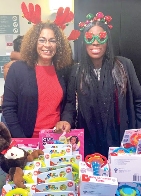 women posing for toy drive